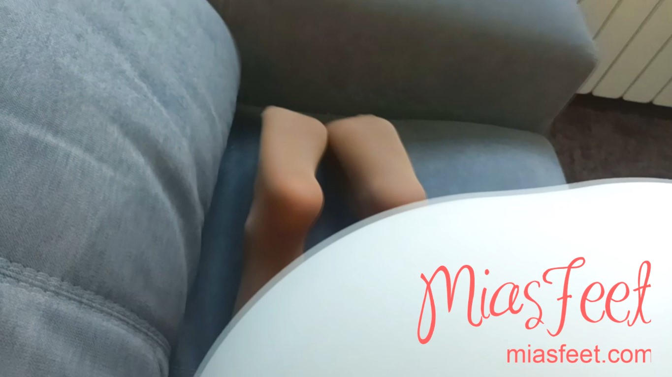 Close up to my feet on the couch while doing a blowjob